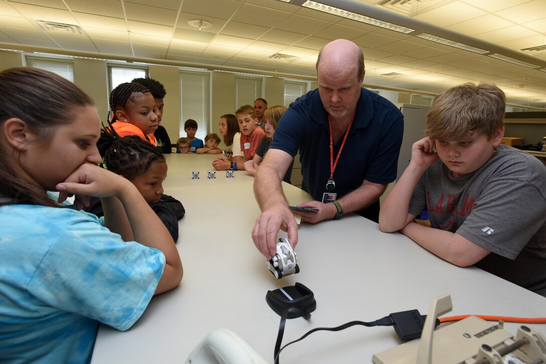 Ron Douglas, Nashville District Information and Technology chief, uses an interactive toy to explain emerging technologies to kids as part of the district’s “Take Your Kids to Work Day” activities at the district headquarters in Nashville, Tenn., April 14, 2017.