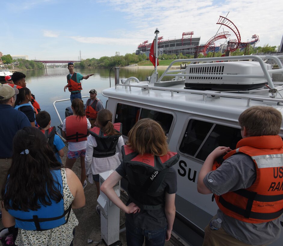 Civil Engineers Noel Smith and Cody Flatt talk about hydrographic surveying with kids who boarded the district’s navigation survey boat as part of the district’s “Take Your Kids to Work Day” activities at Riverfront in Nashville, Tenn., April 14, 2017.