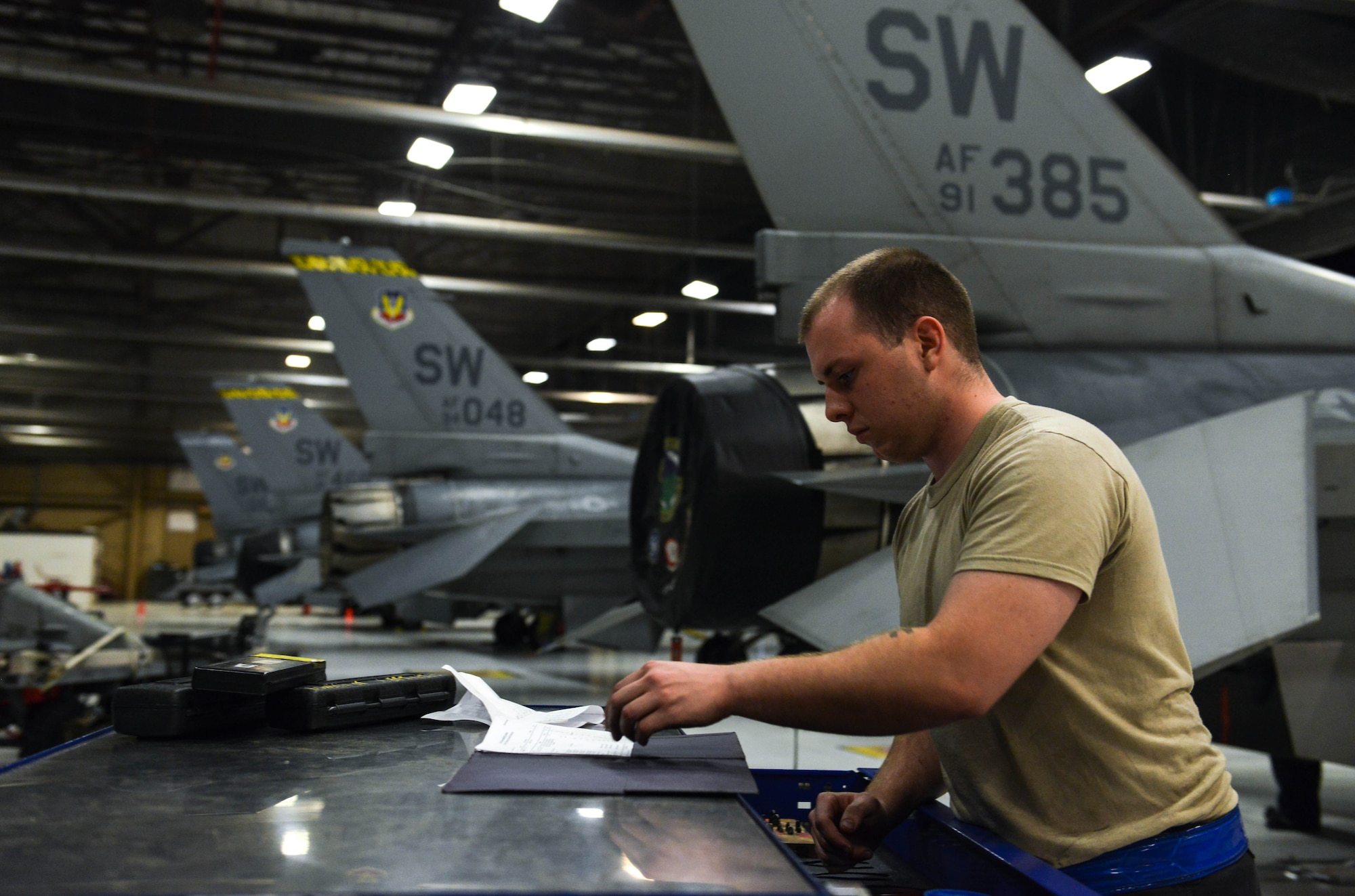 U.S. Air Force Airman 1st Class Ryan Cassidy, 20th Aircraft Maintenance Squadron tactical aircraft maintainer, looks through a toolbox log at Shaw Air Force Base, S.C., April 13, 2017. Tactical aircraft maintainers use logs to keep accountability of tools at all times. (U.S. Air Force photo by Airman 1st Class Destinee Sweeney)