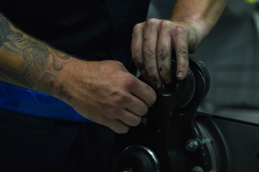 U.S. Air Force Staff Sgt. Seth Puit, 20th Aircraft Maintenance Squadron tactical aircraft maintainer, prepares a bracket boss to be reconnected to an F-16CM Fighting Falcon at Shaw Air Force Base, S.C., April 13, 2017. The bracket boss acts as a joint for a flapper panel, which is part of the F-16’s wing and helps the pilot control the aircraft. (U.S. Air Force photo by Airman 1st Class Destinee Sweeney)