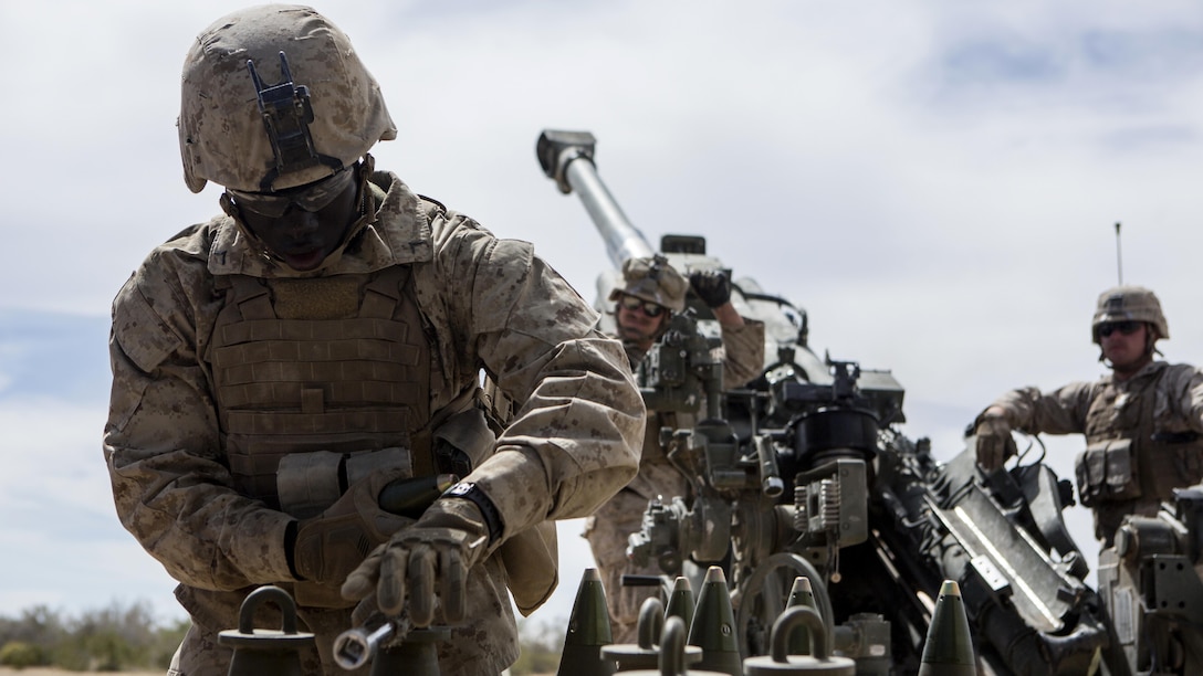U.S. Marine Corps Pfc. Mamadou A. Diarra, a field artillery cannoneer with Battery B, 1st Battalion, 10th Marine Regiment prepares ammunition during assault support tactics 1 in support of Weapons and Tactics Instructor Course 2-17 at Fire Base Burt, Calif., April 17, 2017. AST-1 is a battalion reinforced air assault exercise, supported by fixed wing and rotary wing aviation fires, aviation delivered artillery, and mortars. WTI is a seven-week training event hosted by Marine Aviation Weapons and Tactics Squadron One cadre, which emphasizes operational integration of the six functions of Marine Corps aviation in support of a Marine Air Ground Task Force and provides standardized advanced tactical training and certification of unit instructor qualifications to support Marine Aviation Training and Readiness and assists in developing and employing aviation weapons and tactics.