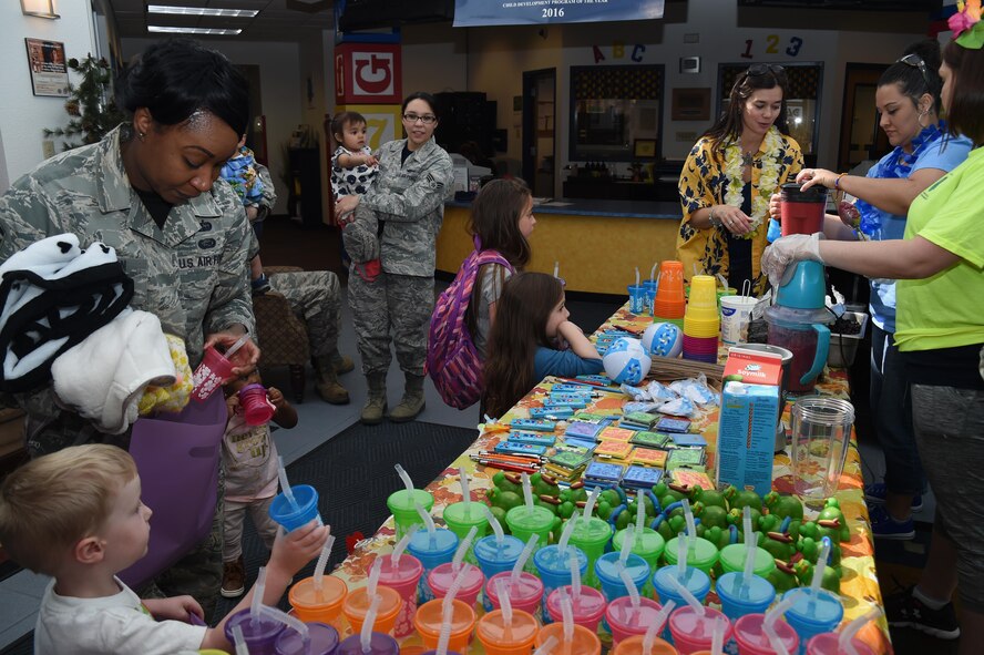 Schriever members and military kids line up for smoothies at Schriever Air Force Base, Colorado, Friday, April 14, 2017. This marked the fourth consecutive year a smoothie bar was set up at the Child Development Center during the Month of the Military Child. (U.S. Air Force photo/Senior Airman Arielle Vasquez)