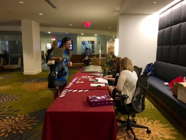 Middle East District team members Becky Moser and Lacey Sandate welcome and register industry officials to the informational event in Herndon, Va., Wednesday, April 12. 
