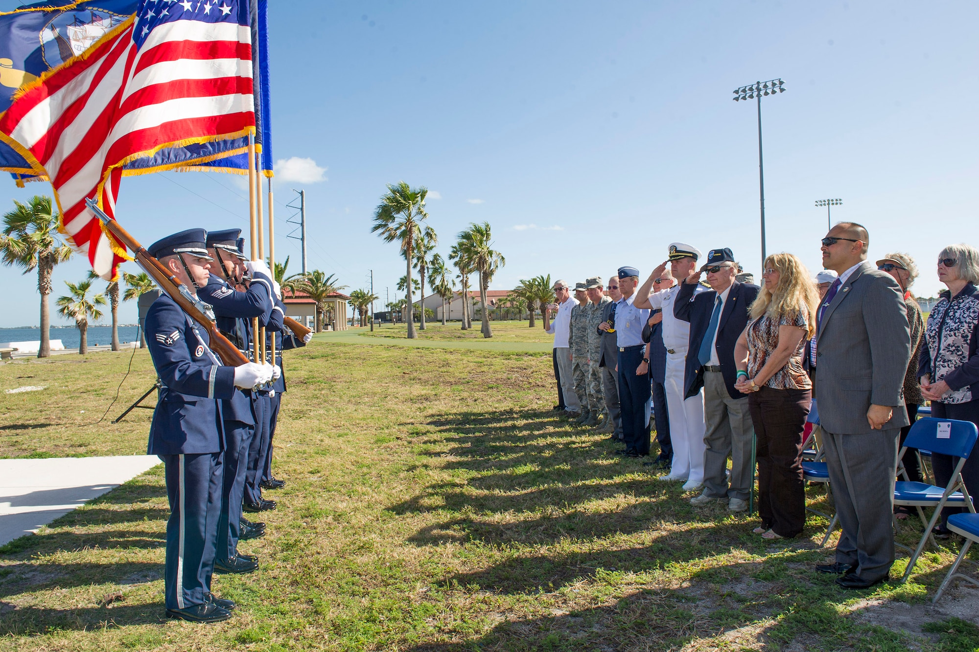 Members of the audience salute the American Flag during the playing of the National Anthem at the Banana River Naval Air Station monument unveiling ceremony April 11, 2017, at Patrick Air Force Base, Fla. The 45th Space Wing hosted a dedication ceremony for the Martin PBM-5 Mariner Memorial honoring 13 service members who lost their lives during a rescue mission supporting the 1945 disappearance of Flight 19.  (U.S. Air Force photo by Phil Sunkel)