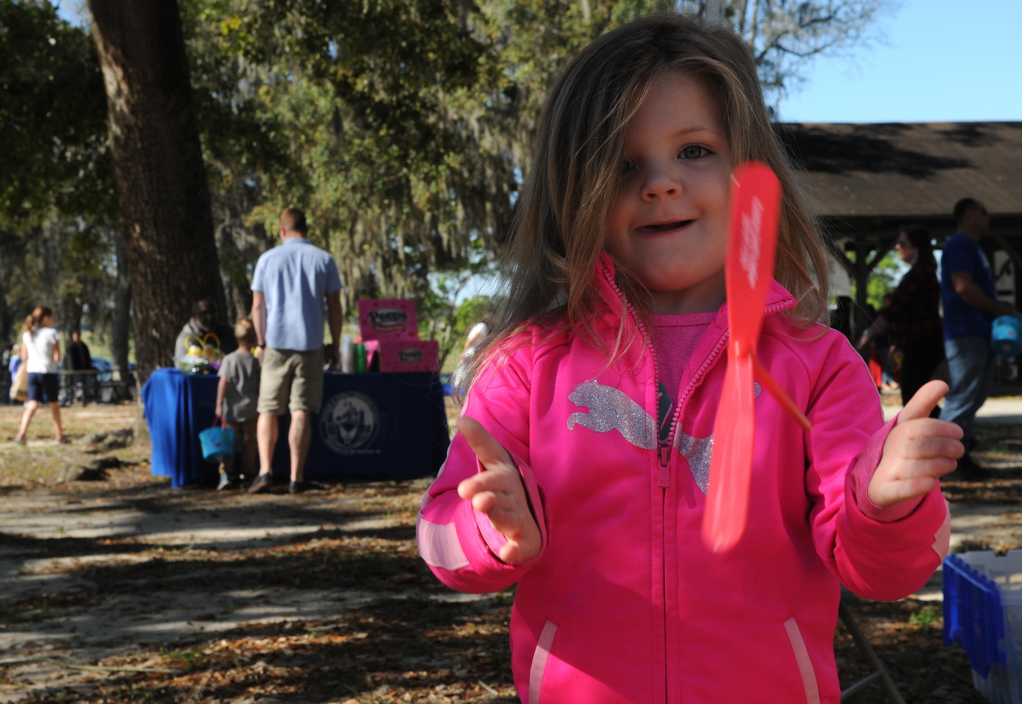 Annelise McClure, daughter of Luke McClure, Keesler Family Housing representative, plays with a toy during Child Pride Day April 8, 2017, on Keesler Air Force Base, Miss. The event festivities included a parade, Easter egg hunt, arts and crafts and information booths for more than 1,000 children and family members in celebration of the Month of the Military Child. (U.S. Air Force photo by Senior Airman Holly Mansfield) 