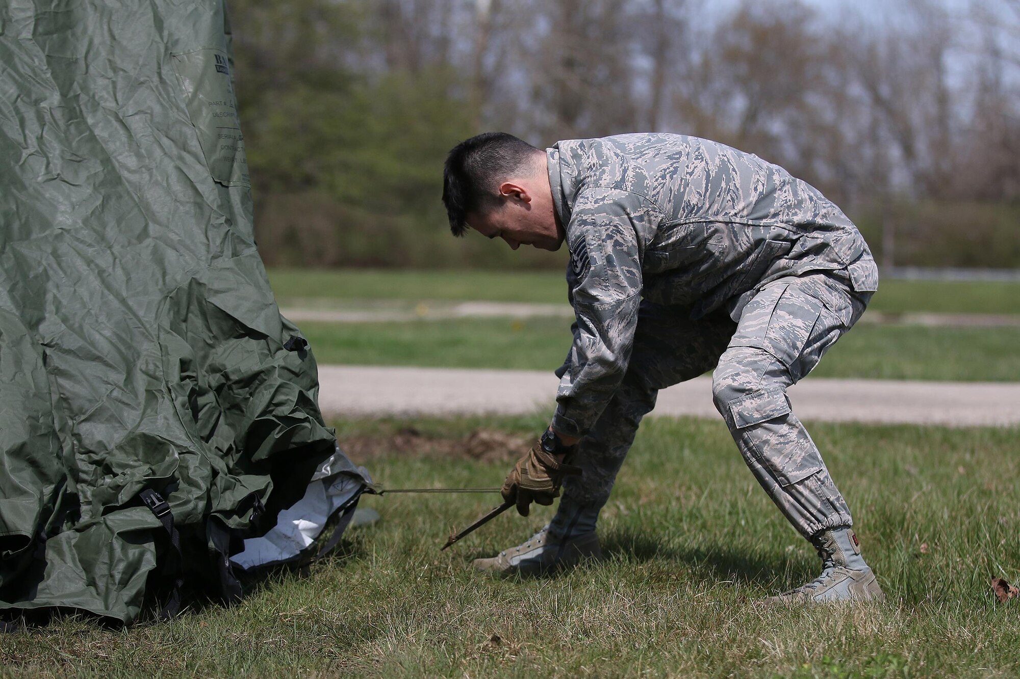Staff Sgt. Joel Ford, 445th Security Forces Squadron, applies tension while setting up an expedition shelter during the April 2, 2017 unit training assembly. The shelter will be used for a bivouac in preparation for deployment training in May. (U.S. Air Force photo /Tech. Sgt. Patrick O’Reilly)