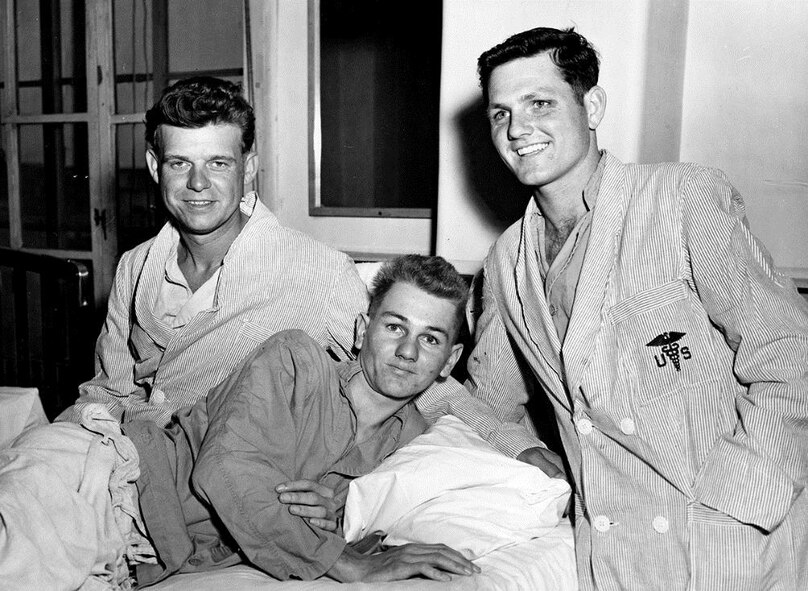 HQ, FEAF, TOKYO --- Following their return to Japan after release, the first three U. S. Air Force repatriates relax at an Army hospital in Tokyo.  The three (left to right) are Capt. Zach W. Dean of El Dorado, Kansas, an F-51 Mustang pilot shot down on April 22, 1951; A/2C Robert L. Weinbrandt of El Cajon, California, a B-29 "Super Fortress tail gunner captured after his plane was shot down the night of January 28 29, 1953, and A/2C William R. Hilycord of  Columbus, Indiana., a B-26 Invader air crewman held since December, 1951. 