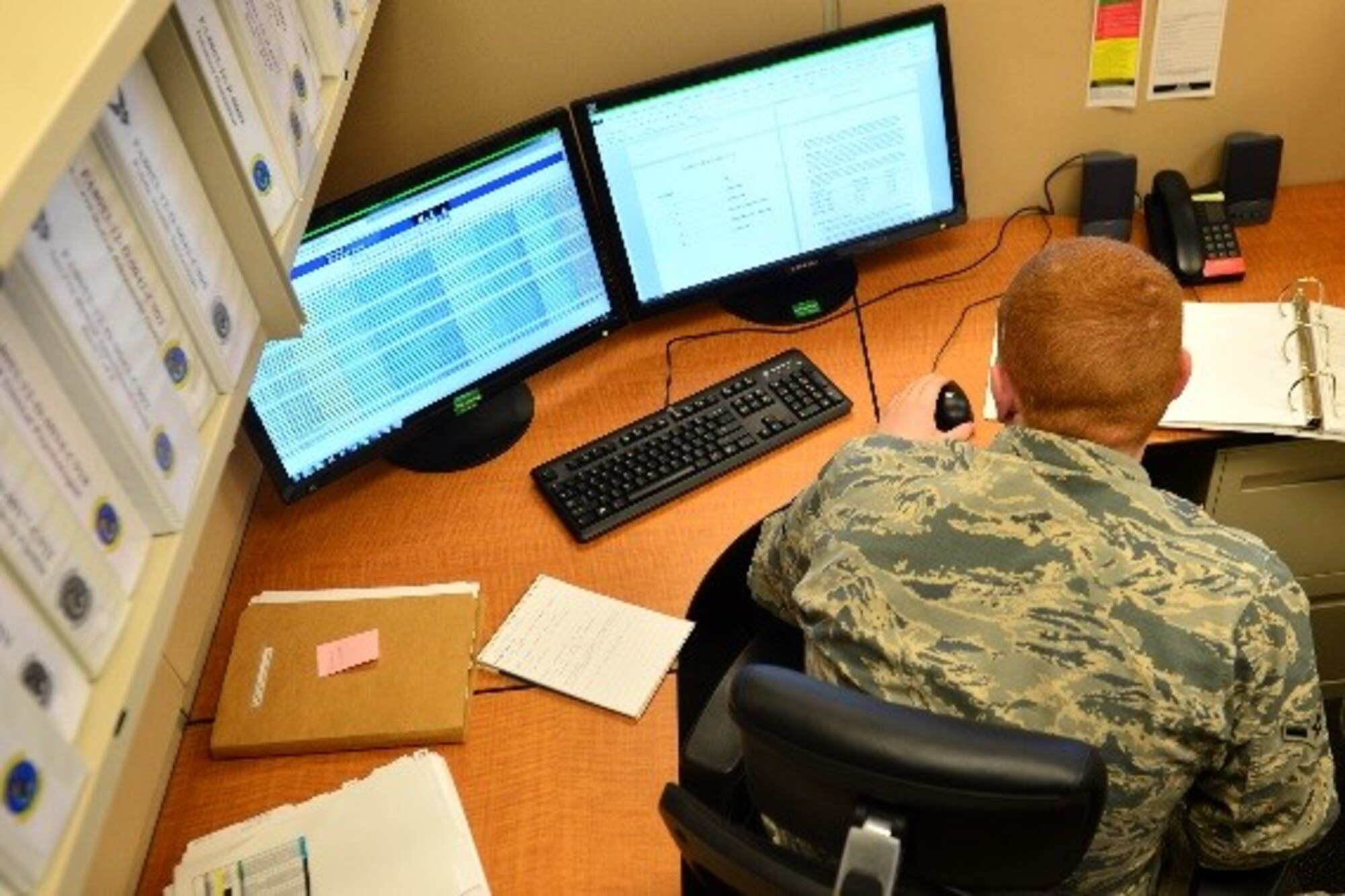 U.S. Air Force Airman Brendan Harrah, 20th Contracting Squadron (CONS) contracting specialist, reviews a contract at Shaw Air Force Base, S.C., April 11, 2017. Airmen assigned to the 20th CONS manage funding for contractors on base who work on tasks ranging from building renovations to road construction. (U.S. Air Force photo by Airman 1st Class Christopher Maldonado)