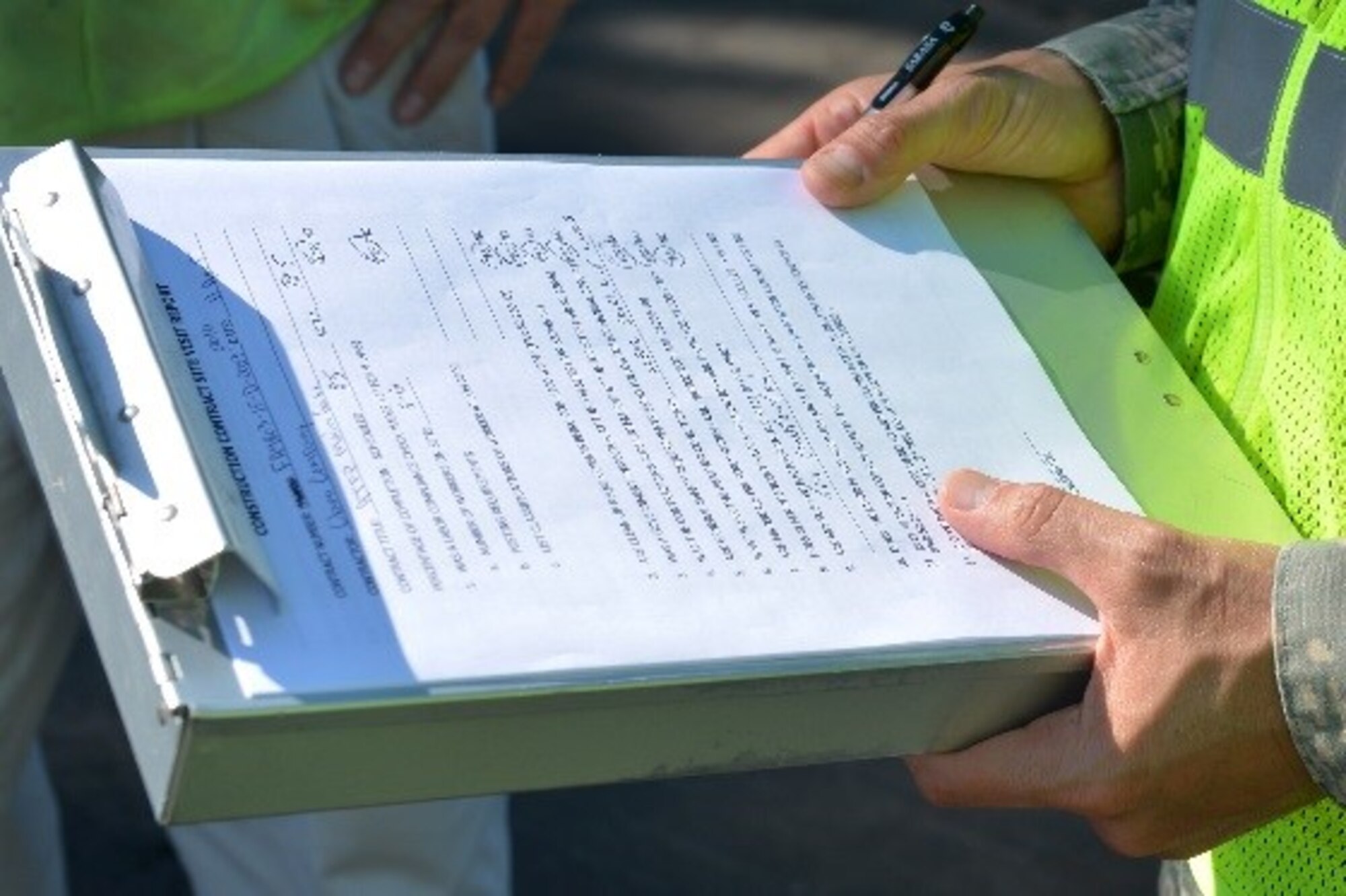 A U.S. Airman assigned to the 20th Contracting Squadron (CONS) reviews a construction contract site visit report at Shaw Air Force Base, S.C., April 11, 2017. Site visits provide 20th CONS Airmen insight to contractor operations while also determining further equipment or resources required. (U.S. Air Force photo by Airman 1st Class Christopher Maldonado)