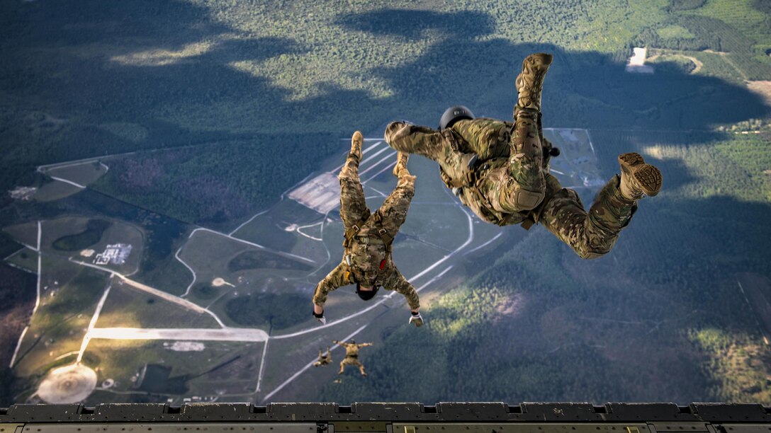 Airmen jump from the back of an HC-130J Combat King II aircraft over Moody Air Force Base, Ga., April 13, 2017. The airmen are pararescuemen who are qualified experts in airborne and military free fall operations. Air Force photo by Staff Sgt. Ryan Callaghan