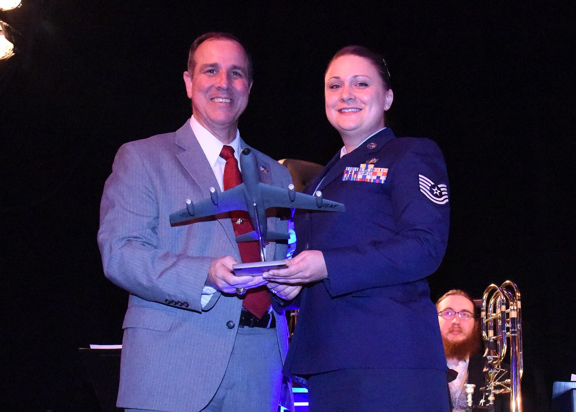 Tech. Sgt. Lindsay Mayer, 92nd Force Support Squadron NCO in charge of force management, receives the Noncommissioned Officer of the Year Award from the West Plains Chamber of Commerce at the Best of the West Awards Gala April 14 in Airway Heights, Wash. The event recognized outstanding contributions to the local community. (U.S. Air Force photo/Staff Sgt. Samantha Krolikowski)