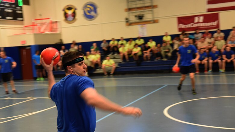 Aaron Hines, 1st Space Operations Squadron, prepares to throw a dodgeball during the annual Sexual Assault Awareness and Prevention Month Dodgeball Tournament at Schriever Air Force Base, Colorado, Friday, April 14, 2017. His squadron placed third behind the 21st Space Wing’s Family Advocacy Program and the 50th Security Forces Squadron. (U.S. Air Force photo/Airman 1st Class William Tracy)