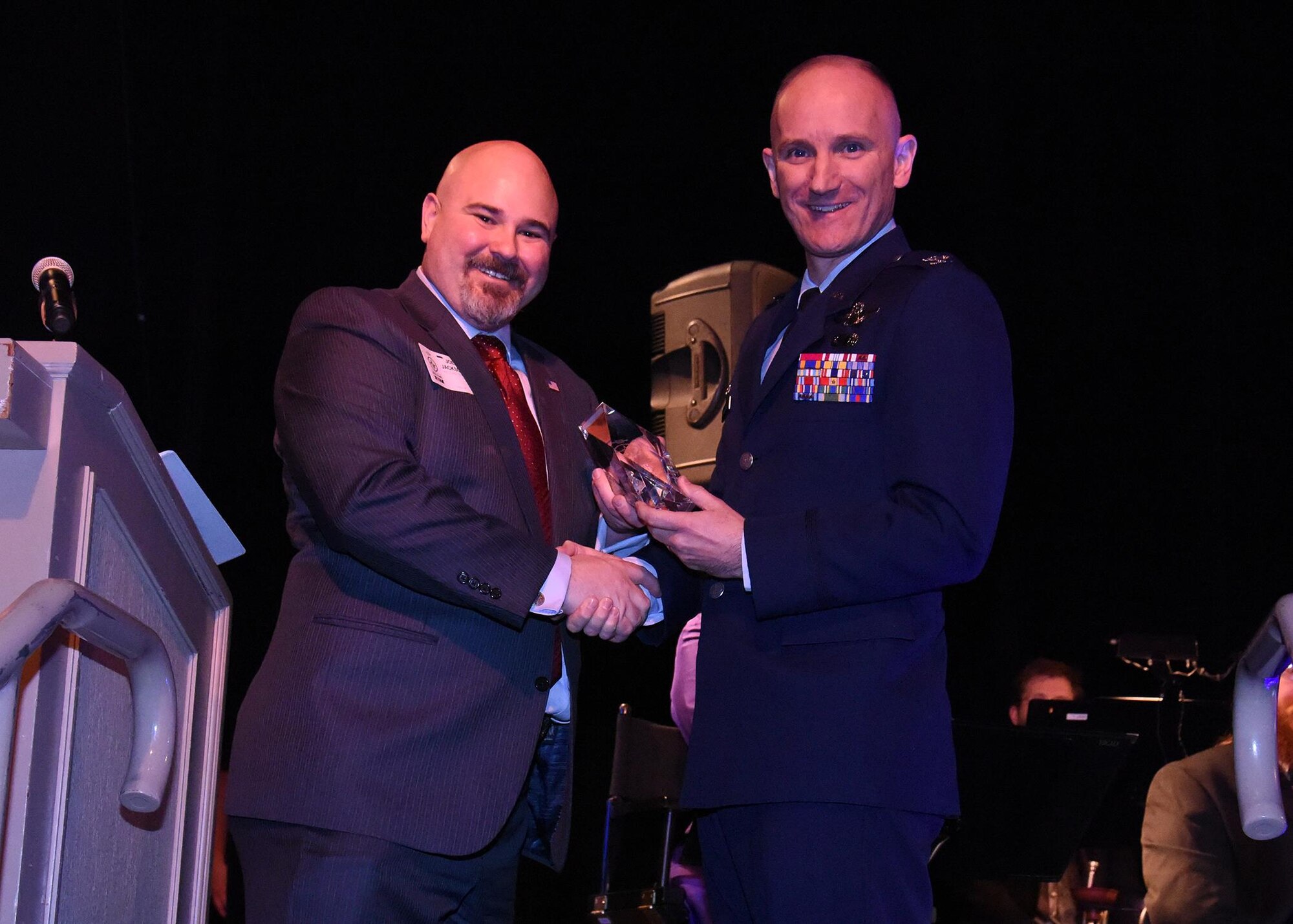Col. Ryan Samuelson, 92nd Air Refueling Wing commander, receives the Most Uniquely West Plains Award from the West Plains Chamber of Commerce at the Best of the West Awards Gala April 14 in Airway Heights, Wash. The award recognizes and celebrates a company, event or icon that embraces the unique vibrant nature of the West Plains Culture and exemplifies what it ultimately means to live, work and play in the West Plains. (U.S. Air Force photo/Staff Sgt. Samantha Krolikowski)