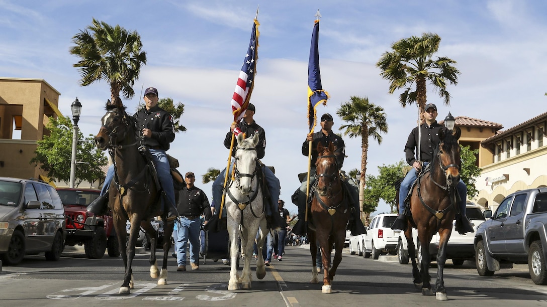 Mounted soldiers ride horses during the 5th annual Denim Day walk at Fort Irwin, Calif., April 17, 2017. Denim Day is an international campaign promoting awareness of sexual assault and harassment. More than 3,000 Fort Irwin soldiers, family members and civilians wore denim jeans and teal-colored shirts as symbols to oppose sexual assault and harassment. Army photo by Pfc. Austin Anyzeski
