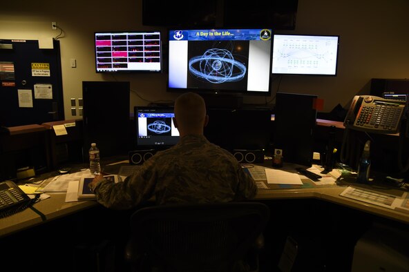 Maj. Gregory Stewart, 22nd Space Operations Squadron mission commander, oversees the Air Force Satellite Control Network antennas from all over the world to ensure they are operating efficiently and providing support to the users at Schriever Air Force Base, Colorado, Wednesday, April 5, 2017. On average, the AFSCN enables more than 450 satellite contacts per day. (U.S. Air Force photo/Tech. Sgt. Julius Delos Reyes) 
