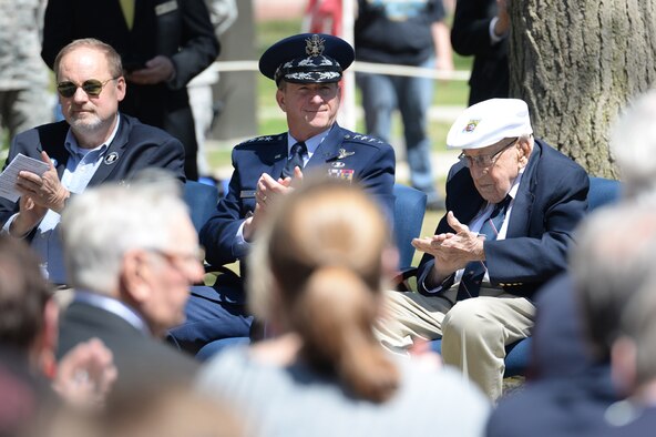 Chief of the Staff of the Air Force General David L. Goldfein, applauds during the 75th Anniversary of the Doolittle Raid
Memorial Ceremony at the National Museum of the United States Air Force, April 18, 2017. Gen. Goldfein, who spoke at the ceremony, paid tribute to the Doolittle Raiders, to include Lt. Col. (Ret.) Richard E. Cole, the sole surviving member of the Doolittle Raiders (right), and Staff Sgt. David Thatcher, who passed in June 2016. Also attending the ceremony were friends
and family of the Doolittle Raiders, including Sgt. Thatcher's son, Jeff Thatcher (left). (U.S. Air Force Photo by Wesley Farnsworth)