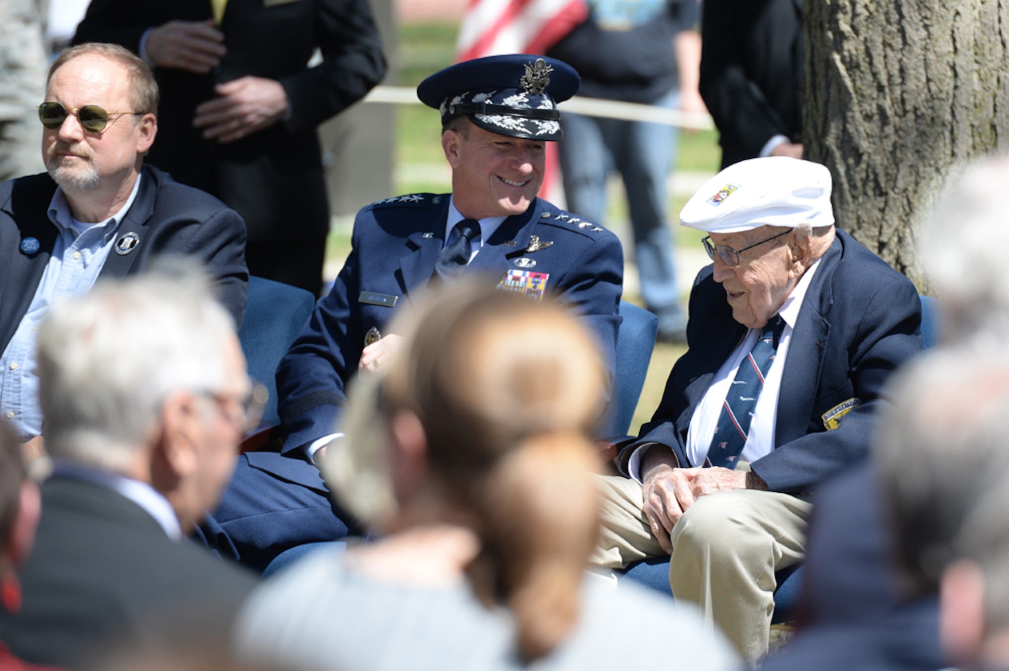 Chief of the Staff of the Air Force, Gen. David L. Goldfein, talks to Lt. Col. (Ret.) Richard E. Cole, the sole surviving member
of the Doolittle Raiders (right) during the 75th Anniversary of the
Doolittle Raid Memorial Ceremony at the National Museum of the United States Air Force, April 18, 2017. Also attending was Jeff Thatcher (left), the son of Doolittle Raider Staff Sgt. David Thatcher, who passed in June 2016. (U.S. Air Force Photo/ Wesley Farnsworth)
