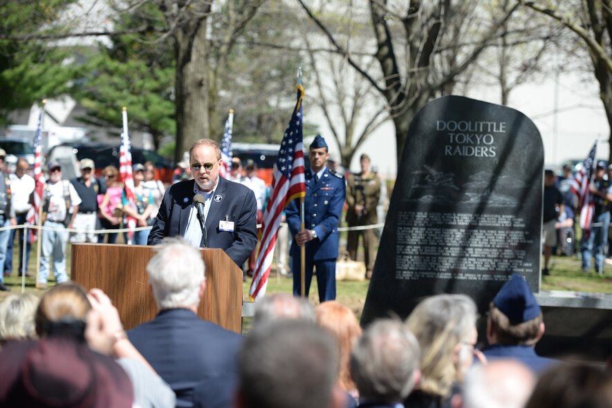 Jeff Thatcher, son of Doolittle Raider, Staff Sgt. David Thatcher, gives remarks at the National Museum of the United States Air Force April 18, 2017. The memorial service, including a wreath laying, honored the 75th anniversary of the Doolittle Tokyo Raid in which 80 volunteers used 16 B-25 bombers to strike the Japanese mainland from the USS Hornet aircraft carrier, turning the tide of World War II. The ceremony included two flyovers of B-25 bombers, one in the missing man formation, and a B-1B bomber flyover, one of which had been rechristened the "Ruptured Duck" in a ceremony the day before. Staff Sgt. Thatcher was a crew member on the original Ruptured Duck, during the Doolittle Raid. (U.S. Air Force photo/Wesley Farnsworth)