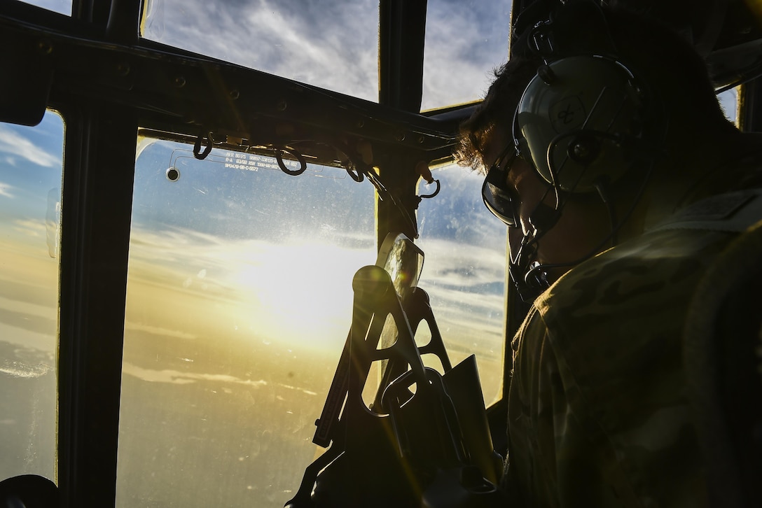 Capt. Jonathan Rodgers, an AC-130U Spooky gunship pilot with the 4th Special Operations Squadron, scans the horizon during a live-fire training mission at the Eglin Range, Fla., April 17, 2017. Aircrew with the 4th SOS conducted a live-fire training mission to ensure mission readiness any time, any place. (U.S. Air Force photo by Airman 1st Class Joseph Pick)