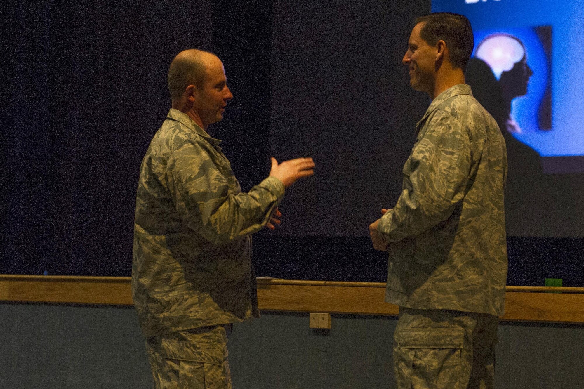 U.S. Air Force Col. Tod Robbins, the 354th Fighter Wing vice commander, speaks with Lt. Col. Regan Patrick, a Profession of Arms Center of Excellence instructor, during a professional development seminar April 13, 2017, at Eielson Air Force Base, Alaska. During the seminar Patrick spoke about personal experiences, shared motivational heritage videos and offered resources to help Airmen become better leaders. (U.S. Air Force photo by Airman 1st Class Isaac Johnson)