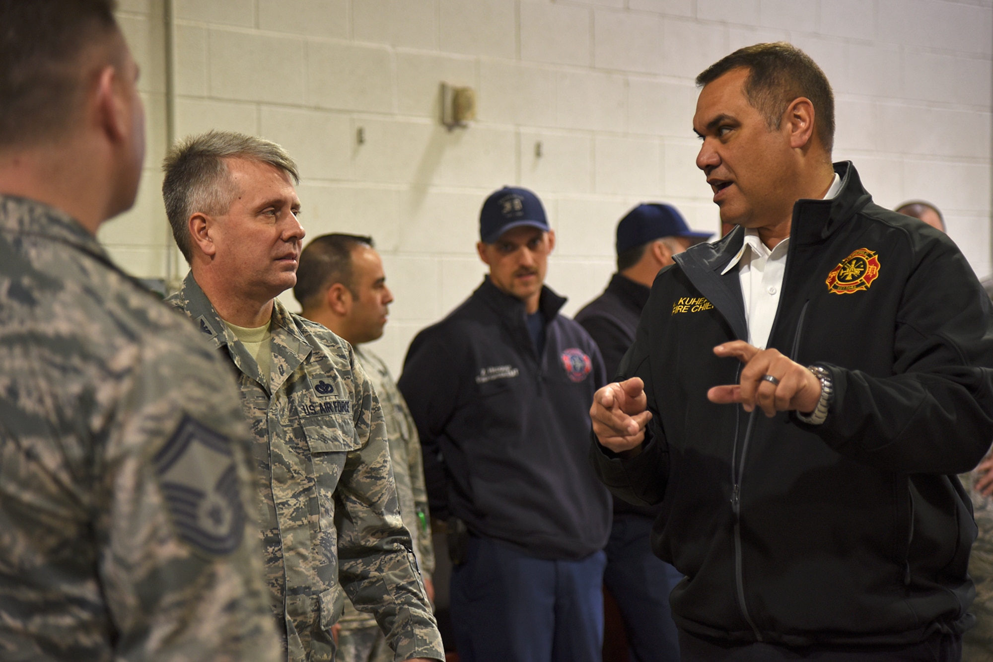 Kimo Kuheana, 92nd Civil Engineer Squadron fire chief, discusses Fairchild Fire Department’s Rapid Intervention Crew training program with Col. James Kossler, Air Force Installation and Mission Support Center Detachment 9 commander, Mar. 29, 2017, at Fairchild Air Force Base, Washington. The AFIMSC was established to help the Air Force make the best use of limited resources in the management and operation of its installations; Detachment 9 oversees functions in the comptroller, civil engineer, communications, security forces, personnel and support career fields. (U.S. Air Force photo/Senior Airman Mackenzie Richardson)