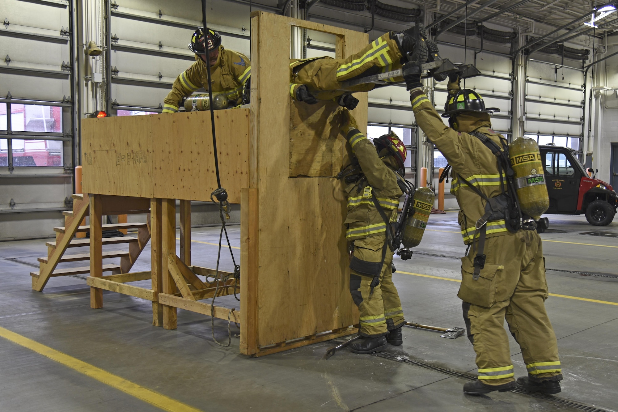 92nd Civil Engineer Squadron firefighters conduct Rapid Intervention Crew training Mar. 29, 2017, at Fairchild Air Force Base, Washington. The crew simulated rescuing two downed firefighters and successfully and safely evacuated the simulated environment by using the various tools available to them. (U.S. Air Force photo/Senior Airman Mackenzie Richardson)