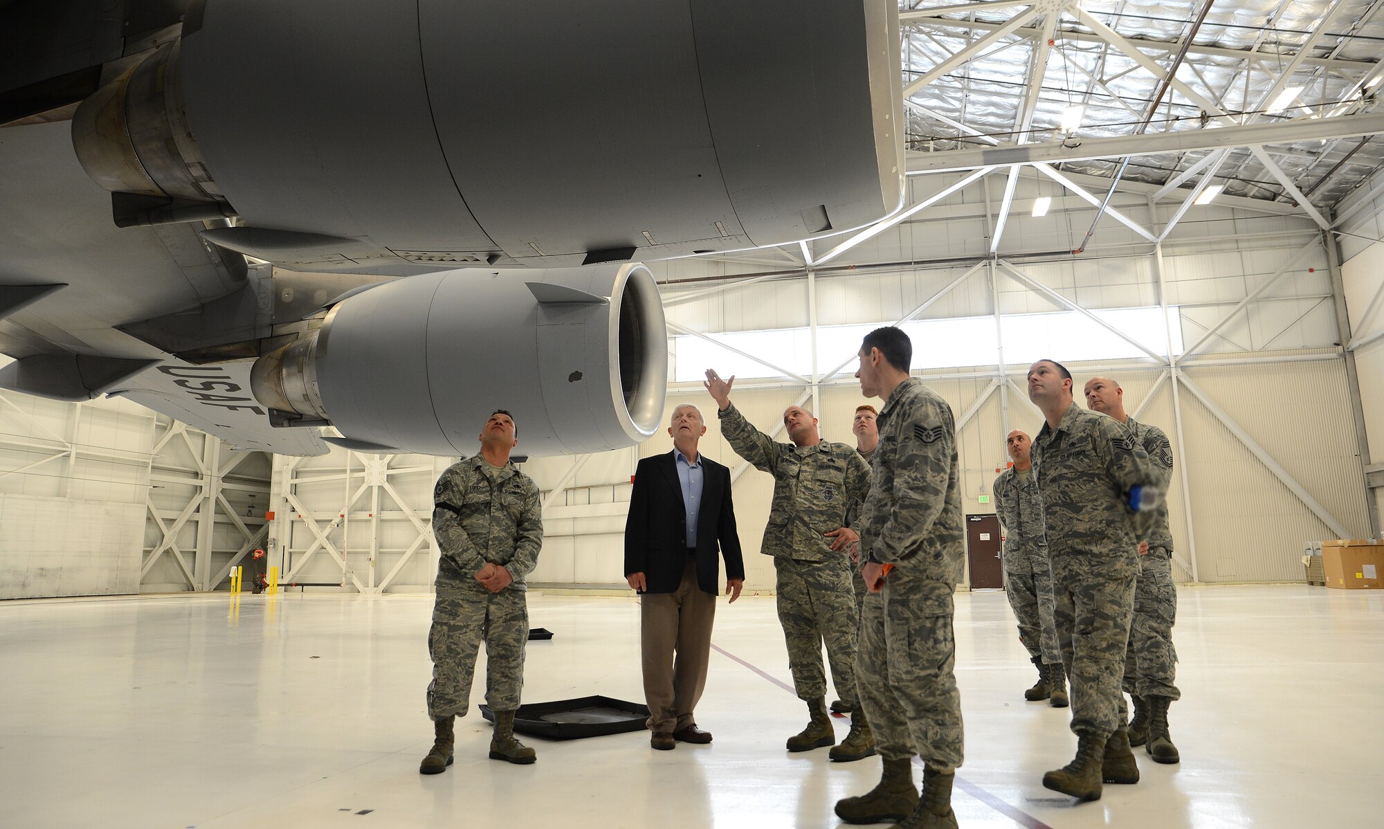 Lt. Col. Mark Szatkowski (center), 62nd Aircraft Maintenance Squadron commander, shows retired Lt. Col. Paul Needham, a former Iranian hostage and guest speaker for Wingman Day, a C-17 Globemaster III April 13, 2017, at Joint Base Lewis-McChord, Wash. Needham was held hostage in Iran for 444 days from November 1979 to January 1981 when he was released. (U.S. Air Force photo/Senior Airman Jacob Jimenez) 