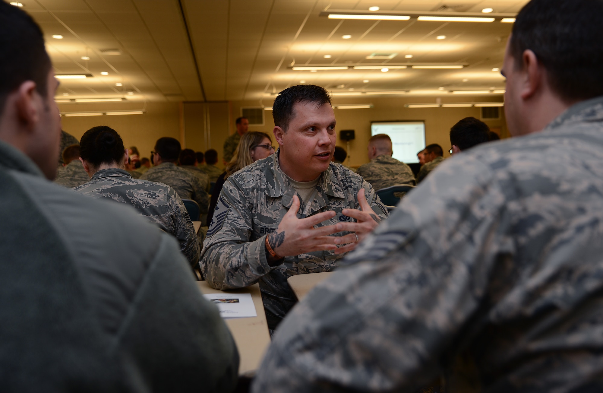 Master Sgt. Ruan Brits, 4th Airlift Squadron first sergeant, mentors Airmen on safety during Wingman Day April 14, 2017, at Joint Base Lewis-McChord, Wash. Mentors gave advice on various topics to include resiliency, health, finances, spiritual health, educational resources, goal setting, transitioning from the military, stress management and leadership. (U.S. Air Force photo/Senior Airman Jacob Jimenez) 