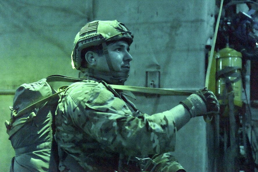 U.S. Air Force Tech.Sgt. Valentin Larios, 51st Operations Support Squadron, waits to perform a static line jump on April 13, 2017, at Yokota Air Base, Japan. SERE is a program created to train aircrew how to survive on their own in any environment under any condition, in the event their aircraft goes down. (U.S. Air Force photo by Machiko Arita)