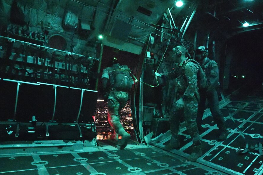 Staff Sgt. Justin Bender, 374th Operations Support Squadron Survival, Evasion, Resistance and Escape training NCO in charge, jumps out of a C-130 Hercules while flying over Yokota Air Base, Japan, April 13, 2017. Members of Air Force Special Operations, SERE specialists work for Pacific Air Forces bases gathered for a SERE working group at Yokota to remain current and proficient. (U.S. Air Force photo by Machiko Arita)