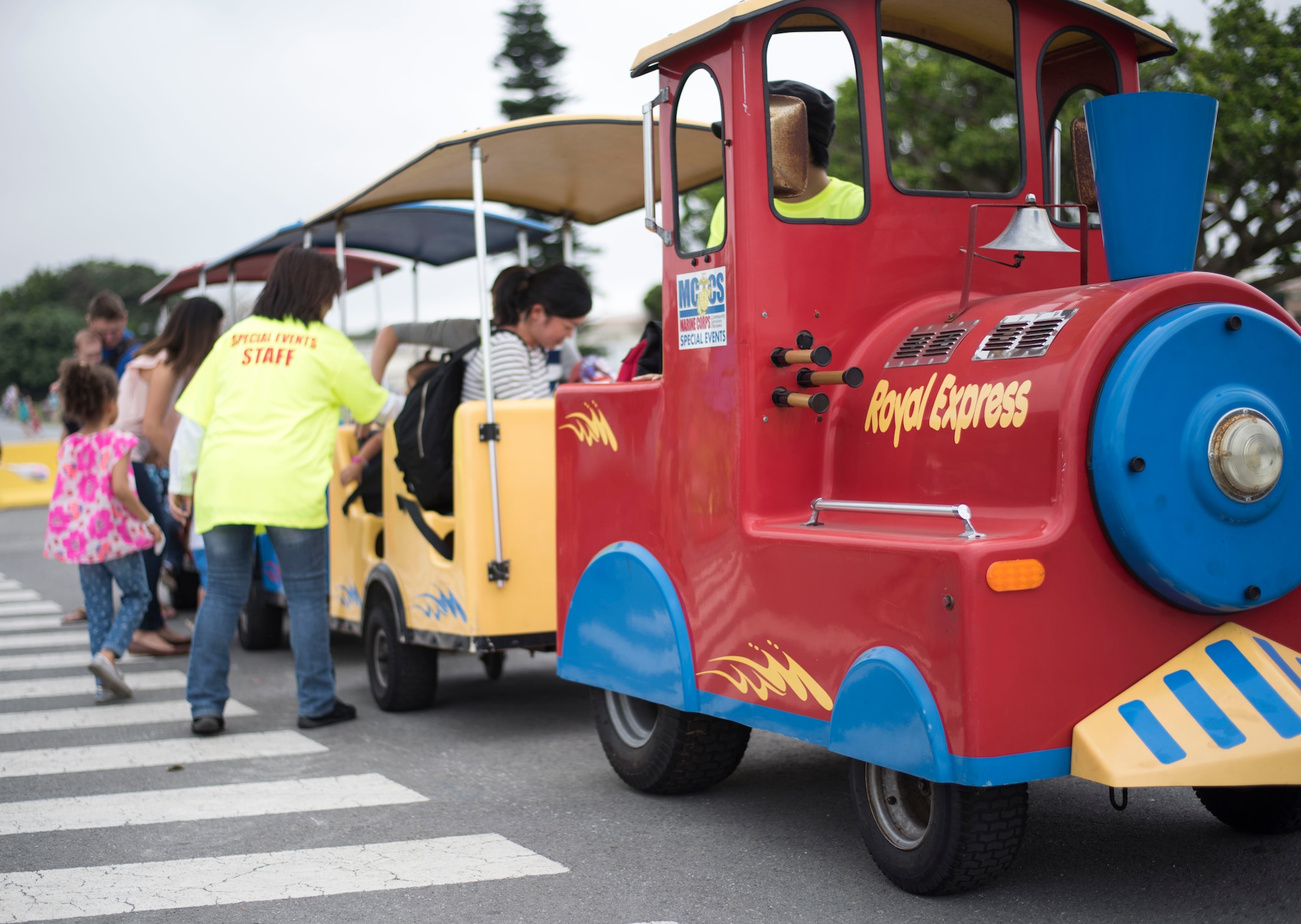 Children and families ride a train at the “Kiddie Land” section of the Eggsplosion event April 15, 2017, at Kadena Air Base, Japan. The 18th Force Support Squadron coordinated and worked together with Marine Corps Community Services on Okinawa to supply entertainment for service members, civilians, and their families during Eggsplosion. (U.S. Air Force photo by Senior Airman Omari Bernard/Released)