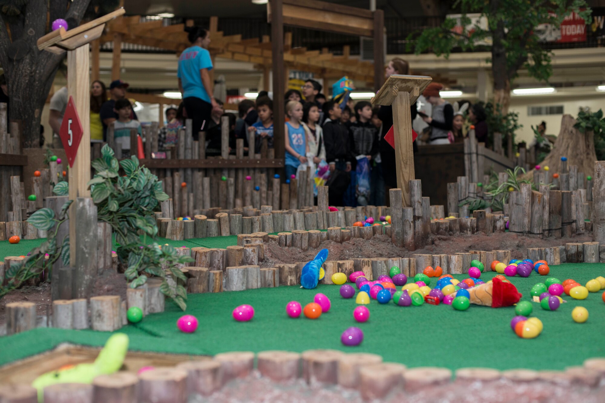 Plastic eggs line the floor as children patiently wait during an Easter egg hunt at Misawa Air Base, Japan, April 15, 2017. The 35th Force Support Squadron held this year’s Easter egg hunt, for children 0-13. (U.S. Air Force photo by Senior Airman Brittany A. Chase)