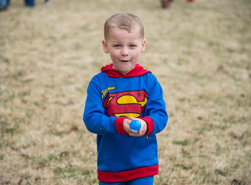 A child focuses while carrying an Easter egg on a spoon at Misawa Air Base, Japan, April 15, 2017. The Base Exchange held an Easter egg hunt, face painting, an egg carrying race and other events for Easter. (U.S. Air Force photo by Senior Airman Brittany A. Chase)