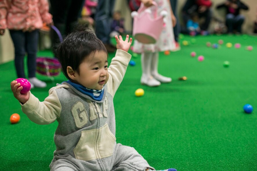 A child holds an egg during an Easter egg hunt at Misawa Air Base, Japan, April 15, 2017. The 35th Force Support Squadron held the Easter egg hunt for ages 0-13at the Weasels Den. (U.S. Air Force photo by Senior Airman Brittany A. Chase)