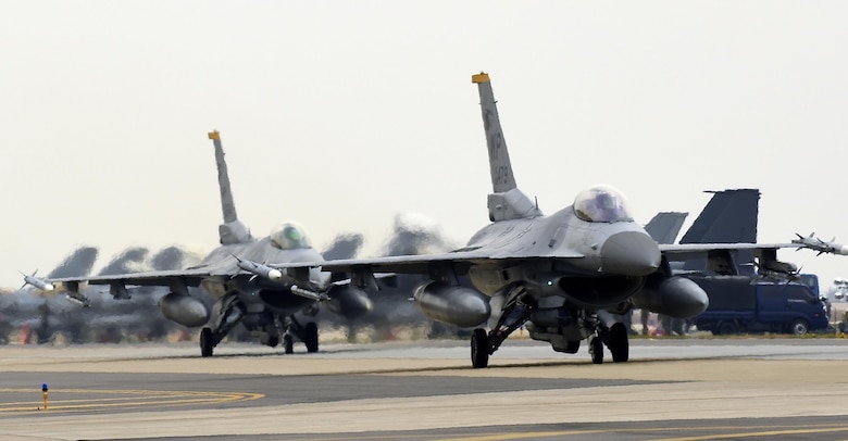 Two U.S. Air Force F-16 Fighting Falcons from the 80th Fighter Squadron taxi down the flightline during Exercise MAX THUNDER 17 at Kunsan Air Base, Republic of Korea, April 18, 2017. Max Thunder is part of a continuous exercise program to enhance interoperability between U.S. and ROK forces. These exercises highlight the longstanding military partnership, commitment and enduring friendship between two nations, which help to ensure security on the Korean Peninsula, and reaffirm the U.S. commitment to stability in the Northeast Asia region. (U.S. Air Force photo by Tech. Sgt. Jeff Andrejcik/Released)