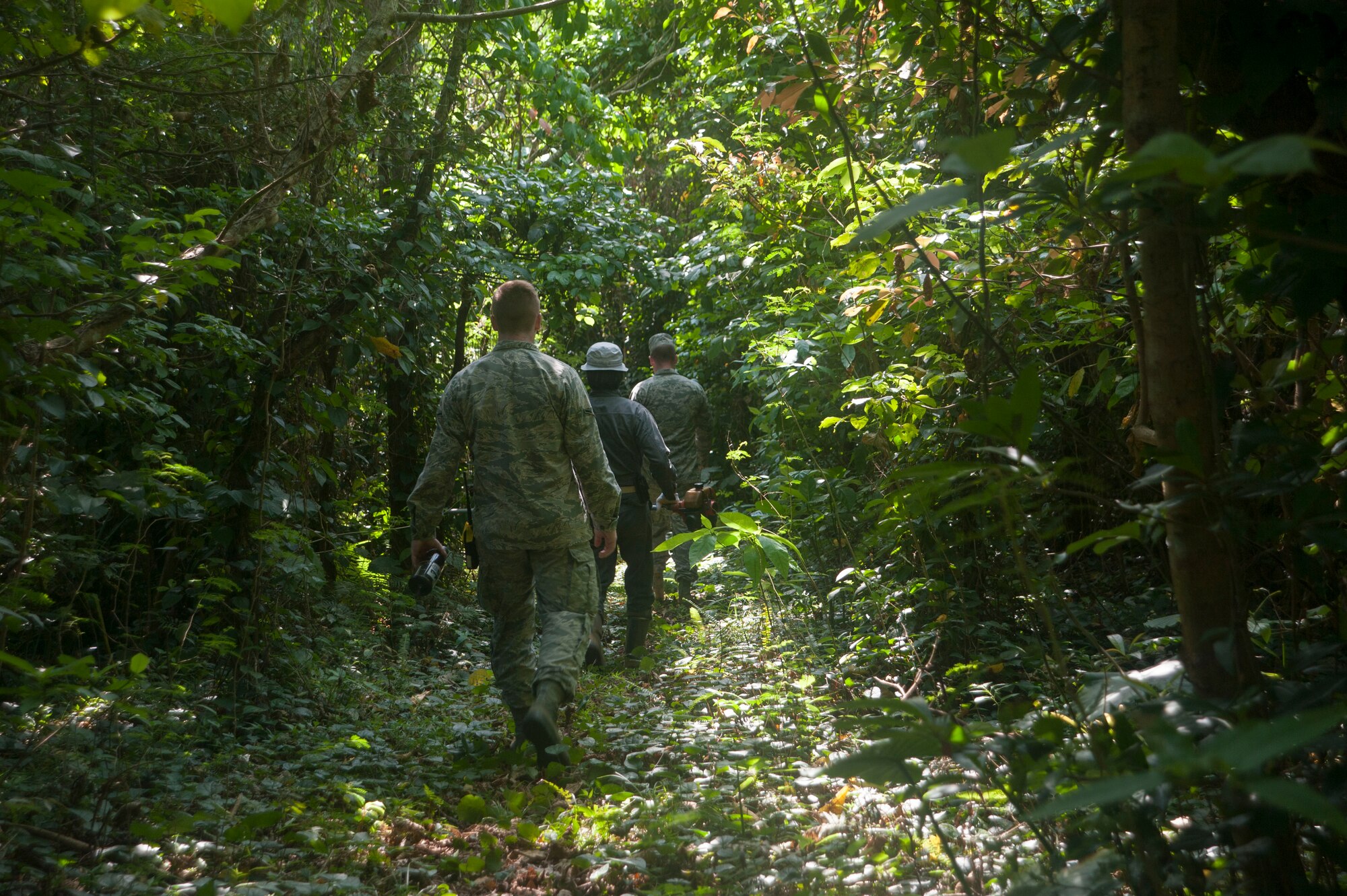 Airmen from the 18th Munitions Squadron escort local Okinawans to their ancestral tombs April 9, 2017, at Kadena Air Base, Japan. Every year, families make their way on base to clean their family tombs and pay their respects to their ancestors. (U.S. Air Force photo by Airman 1st Class Quay Drawdy)