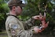 U.S. Air Force Staff Sgt. Andrew Lawrence, a survival, evasion, resistance, and escape instructor, assigned to the 353rd Combat Training Squadron, Eielson Air Force Base, Alaska, prepare a chicken to be cooked in a field environment during Cope North 17 survival training at Andersen AFB, Guam, Feb. 17, 2017. Beginning in 1978 as a quarterly bilateral exercise held at Misawa AB, Japan, Cope North was moved to Andersen AFB in 1999. Today, the annual exercise serves as a keystone event to promote stability and security throughout the Indo-Asia-Pacific by enabling forces to hone vital readiness skills critical to maintainning regional stability. (U.S. Air Force photo by Airman 1st Class Christopher Quail)
