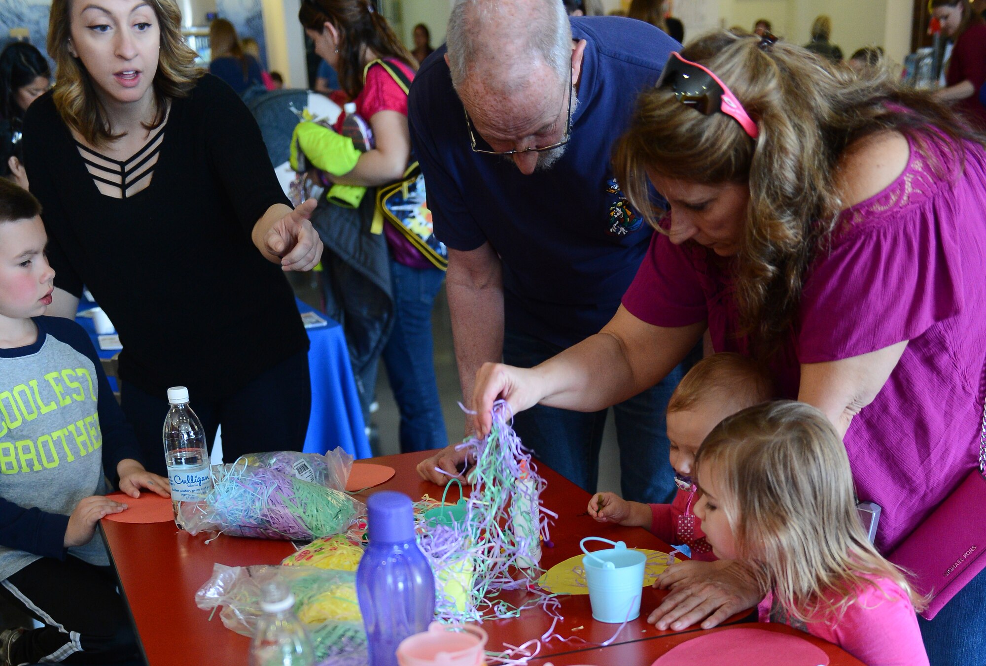 Spangdahlem families decorate paper eggs during the fourth annual Spring Fling event held at the Base Exchange at Spangdahlem Air Base, Germany, April 14, 2017. The Exceptional Family Member Program, along with other various organizations, hosted the event to raise awareness of EFMP and the service it provides for families. (U.S. Air Force photo by Airman 1st Class Preston Cherry)