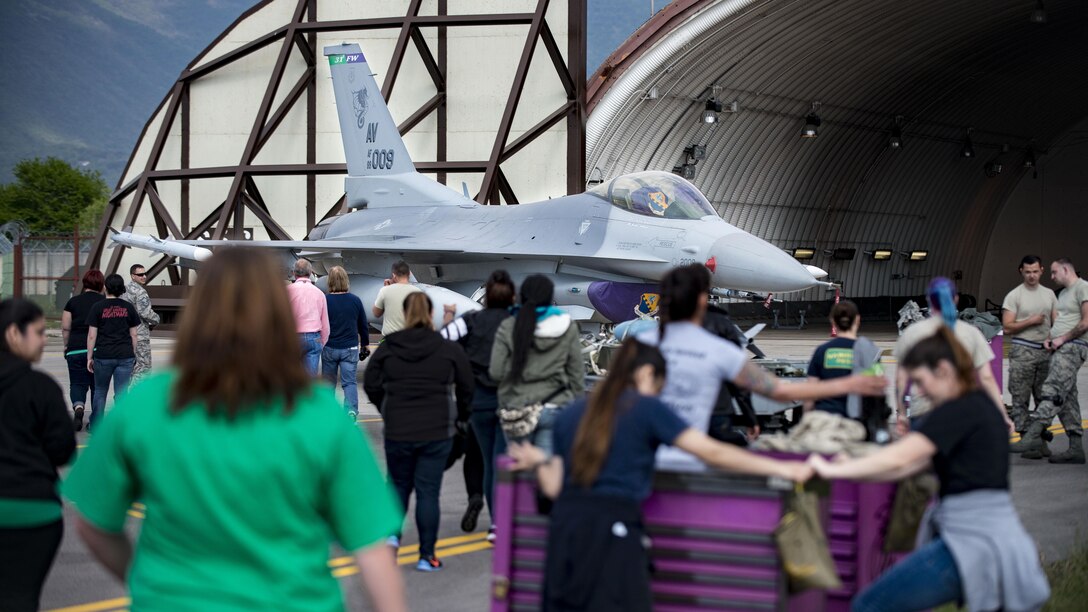 31st Aircraft Maintenance Squadron spouses participate in a Spouses’ Appreciation Day event at Aviano Air Base, Italy, April 12, 2017. The day’s events consisted of a squadron tour, multiple demonstrations of tasks and the ability to perform those tasks 31st AMXS Airmen perform on a day-to-day basis. (U.S. Air Force photo by Senior Airman Cory W. Bush)