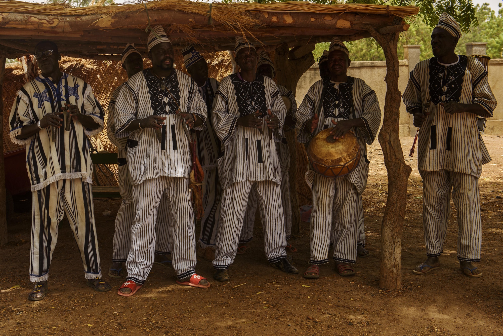 A band plays while welcoming participants of the African Partnership Flight into Titinga Frédéric Pacéré home during a cultural tour near Ouagadougou, Burkina Faso, April 17, 2017. APF in Burkina Faso hosted participants from Chad, Mali, Mauritania, Niger, Cote d’Ivoire and Morocco to help strengthen relationships and share best practices. (U.S. Air Force photo by Staff Sgt. Jonathan Snyder)