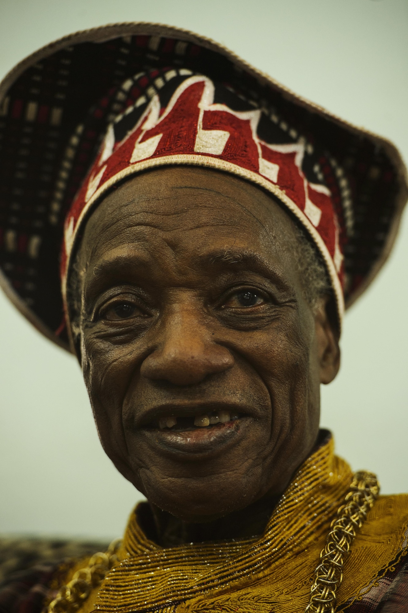 Titinga Frédéric Pacéré talks with participants of African Partnership Flight during a cultural tour near Ouagadougou, Burkina Faso, April 17, 2017. Pacéré is the founder and curator of the Musee de Manega museum preserving local Burkina traditions. (U.S. Air Force photo by Staff Sgt. Jonathan Snyder)