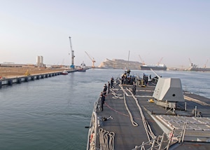 Sailors man the rails on the forecastle of the guided-missile destroyer USS Truxtun (DDG 103) while leaving port in Duqm, Oman. Truxtun is deployed in the U.S. 5th Fleet area of operations in support of maritime security operations designed to reassure allies and partners, and preserve the freedom of navigation and the free flow of commerce in the region.