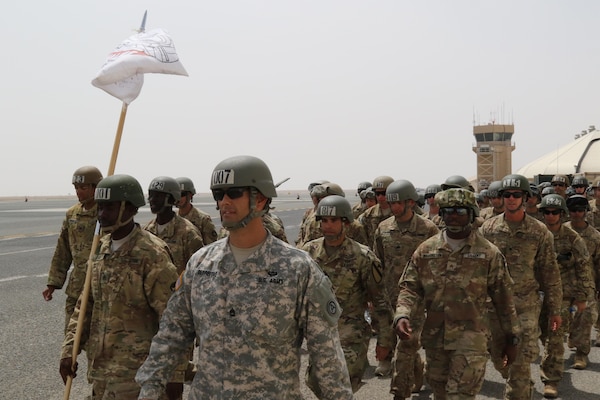 Air Assault candidates, led by U.S. Army Sgt. 1st Class Renato Defreitas, instructor, Basic Leaders Course, march toward a rally point after successfully completing their rappel from a UH-60 Black Hawk helicopter April 13, 2017, at Camp Buehring, Kuwait. The Air Assault Course allows U.S. military personnel in the U.S. Army Central area of operations the unique opportunity to become air assault qualified, while deployed outside the continental United States.