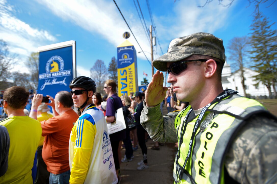 Massachusetts Army National Guard Sgt. Steven Hallorian renders honors during the National Anthem before the start of the 121st Boston Marathon in Hopkinton, Mass., April 17, 2017. Hallorian is a military police officer assigned to the Massachusetts Army National Guard’s 747th Military Police Company. Army National Guard photo by Staff Sgt. Steven C. Eaton