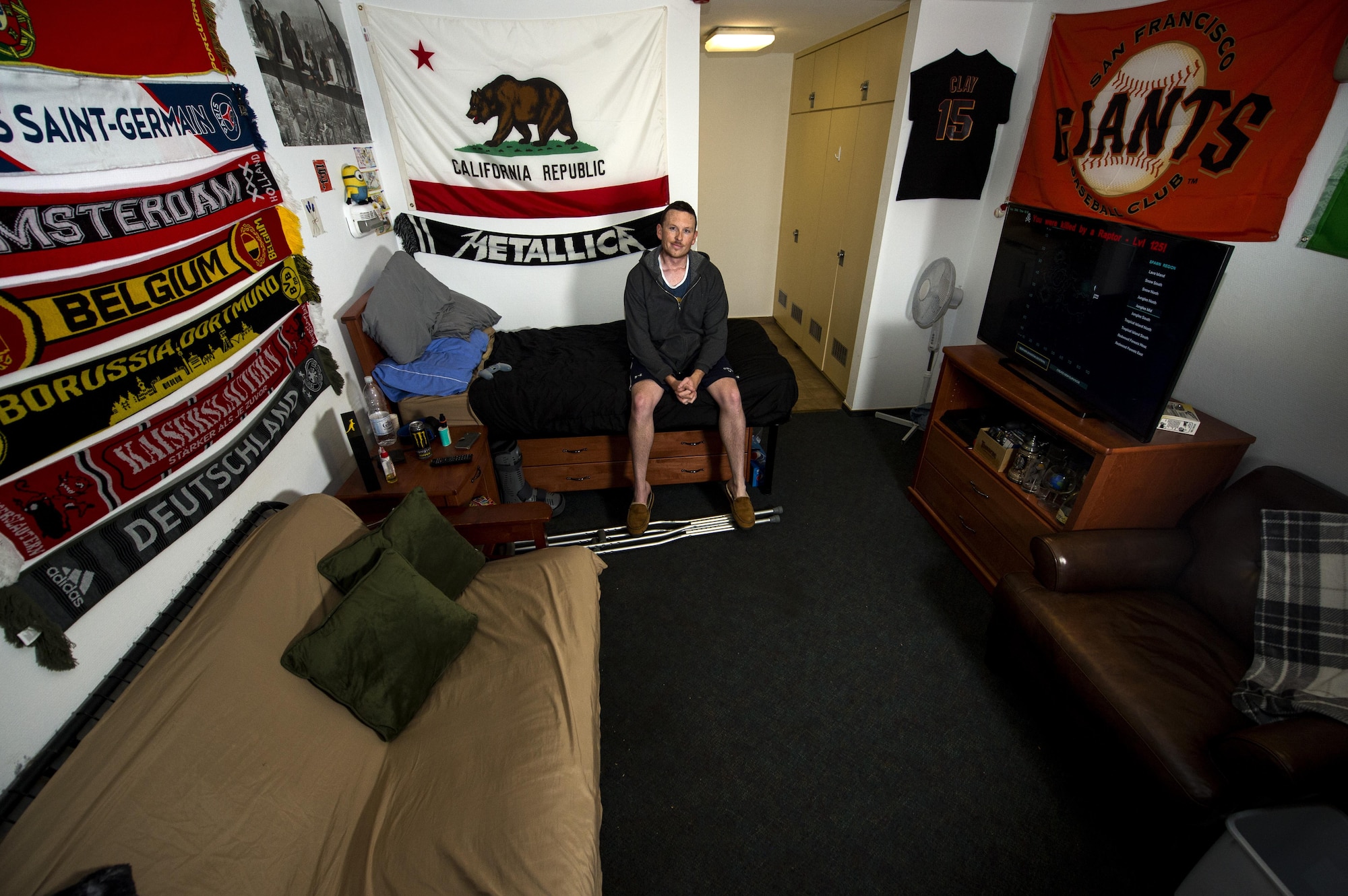 Airman 1st Class Beau Clay, 52nd Civil Engineer Squadron water and fuel systems apprentice, poses in his dorm room at Spangdahlem Air Base, Germany, April 18, 2017. Each quarter an Airman is recognized at the Dorm of the Quarter awards for the best dorm room on base. (U.S. Air Force photo by Airman 1st Class Preston Cherry)