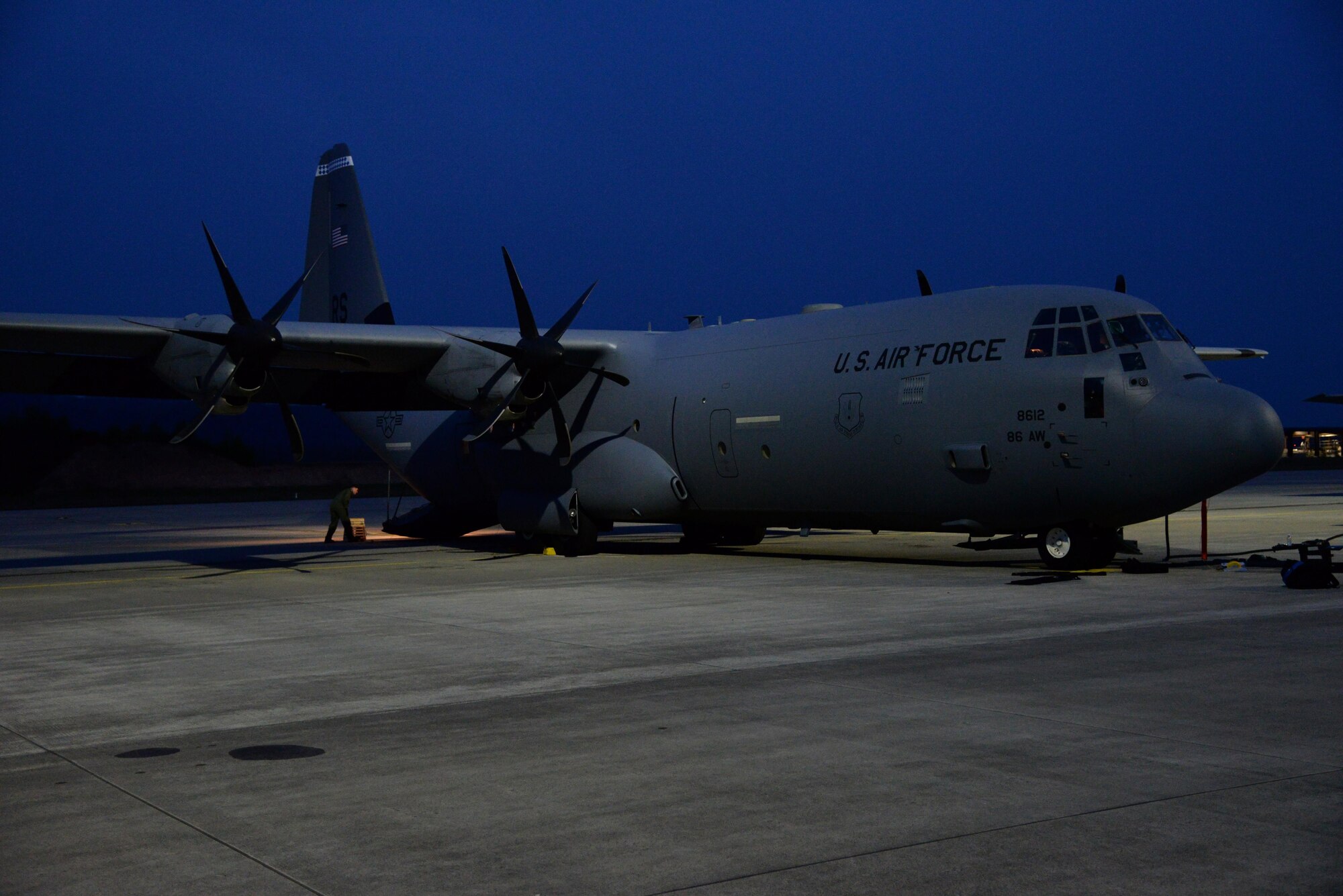 A C-130 aircraft rests on the flightline April 15, on Ramstein Air Base, Germany. The aircraft is scheduled to transport a Tactical Air Navigation system to Romania in support of the theatre security package. (U.S. Air Force photo by Airman 1st Class D. Blake Browning)