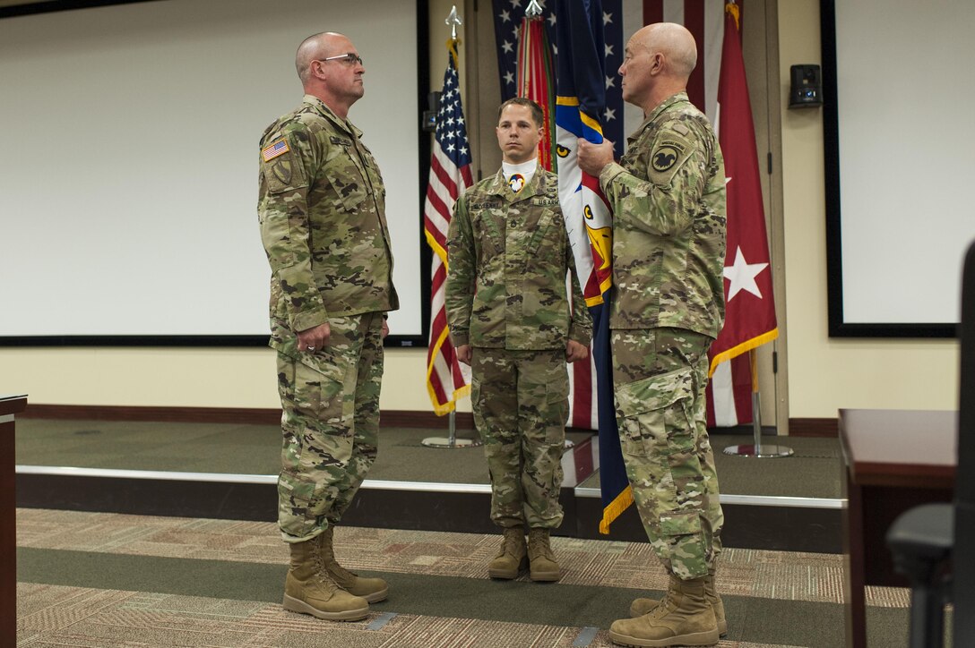 Lt. Gen. Charles D. Luckey, right, chief, Army Reserve and U.S. Army Reserve Command commanding general, prepares hand the colors to Command Sgt. Maj. Ted L. Copeland, during a change of responsibility ceremony at the U.S. Army Forces Command and U.S. Army Reserve Command headquarters, April 18, 2017, at Fort Bragg, NC. Copeland takes over the U.S. Army Reserve's top enlisted position after serving as the command sergeant major of the 79th Sustainment Support Command in Los Alamitos, Calif. (U.S. Army photo by Timothy L. Hale/Released)