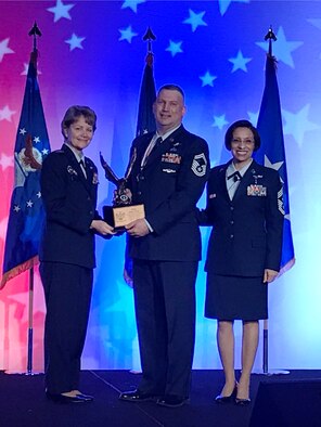 Chief of Air Force Reserve Command, Lt. Gen. Maryanne Miller (left), along with AFRC Command Chief Master Sgt. Ericka Kelly (right), present the AFRC 2016 Outstanding Senior Non-commissioned Officer of the Year award to Senior Master Sgt. Wallace Wood during the annual award banquet at the Sawgrass Marriott Golf Resort, Ponte Vedra Beach, Florida, April 12, 2017.

Wood is an Individual Mobilization Augmentee at the Intelligence, Surveillance and Reconnaissance Division, Joint Base San Antonio-Lackland AFB, Texas.