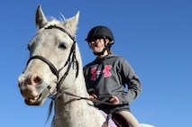 Payton Connor, daughter of 91st Missile Wing Commander Col. Colin Connor, rides her horse Sterling at the Dufresne Riding Club Stables at Minot Air Force Base, N.D., April 11, 2017. New horses must remain in quarantine for 10 days before they can enter the stables. (U.S. Air Force photo/Airman 1st Class Austin M. Thomas)