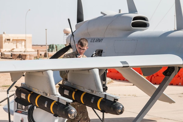 U.S. Army Pfc. Joseph Thury, an unmanned aerial systems maintainer with Company D, 10th Aviation Regiment, 10th Mountain Division, and deployed to Al Asad, Iraq, in support of Combined Joint Task Force-Operation Inherent Resolve, guides the MQ-1C Gray Eagle onto the runway prior to a flight , April 1, 2017. Prior to each flight, the crew systematically goes through multiple check to ensure each Gray Eagle is ready to fly. The Coalition is enabling partnered forces to defeat ISIS by providing air support on the battlefield. CJTF-OIR is the global Coalition to defeat ISIS in Iraq and Syria. (Photo Credit: Spc. Derrik Tribbey)